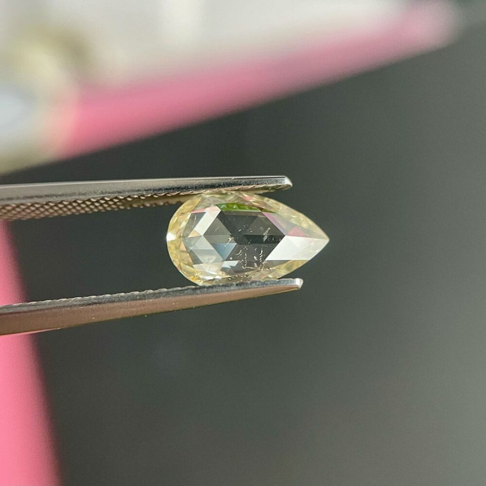 Light yellow pear shape rose cut diamond