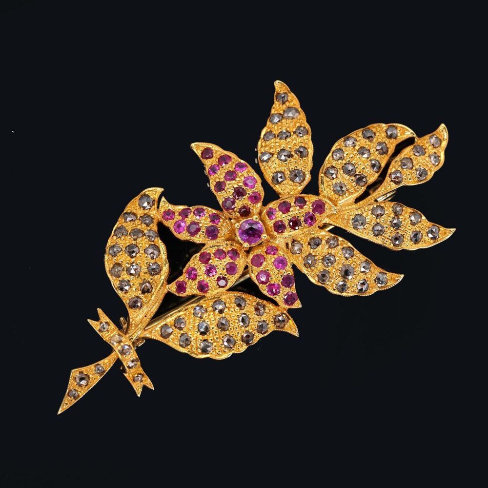 Flower 9k yellow gold brooch with rose cut diamonds and ruby